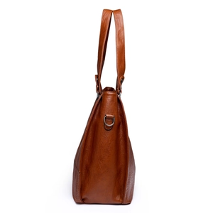 Brown leather tote bag with stylish stitching and metal D-ring for shoulder strap attachment