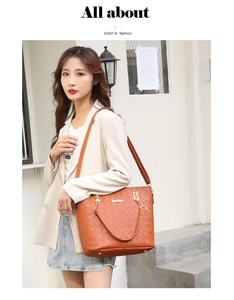 Close-up of brown woven texture tote bag with metal logo and detachable shoulder strap