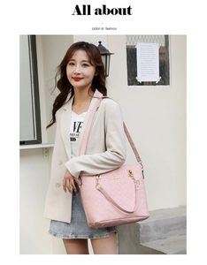 Pink woven texture tote bag detail with golden hardware and brand metal plaque