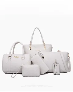 Detail of 6-piece white quilted handbag set with golden hardware and diamond stitching