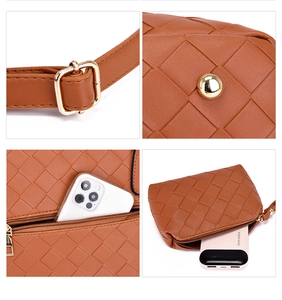 Detail view of brown woven handbag featuring golden hardware and leather texture details