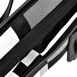 Macro shot of the durable metal zipper and checkerboard mesh fabric detail