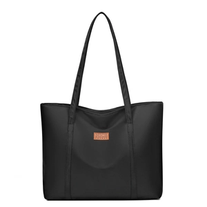 Large capacity black nylon tote bag with reinforced straps and leather logo patch