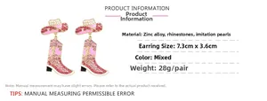 Detail showing dimensions of pink rhinestone cowboy boot and hat earrings, 7.3cm x 3.6cm
