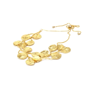 Detailed view of adjustable golden leaf necklace with textured matte finish and bolo chain