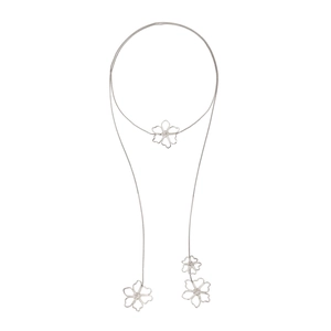 Elegant long silver metal chain necklace with four hollow floral pendants on white background