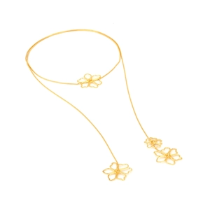 Vintage gold Y-shaped lariat necklace with hollow flower pendants on a snake chain