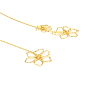 Vintage long metal chain necklace with gold hollow flower pendant for women in chic style