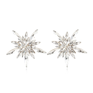 Detailed view of shimmering snowflake stud earrings with marquee-cut crystals and gold plating