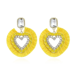 Exaggerated yellow heart tassel earrings with rhinestone accents and silk fringe details