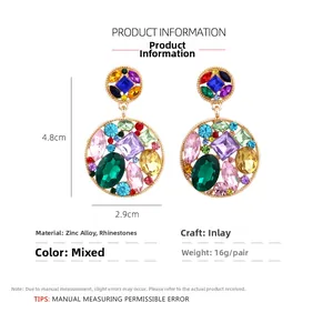 Detail of colorful rhinestone earrings in gold alloy with dimensions 4.8cm x 2.9cm