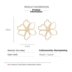 Macro view of oversized gold hollow flower earrings showing 4.8cm zinc alloy dimensions