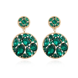 Statement gold-tone alloy earrings with vibrant green crystals in a hollow round design