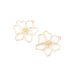 Elegant gold flower stud earrings with heart-shaped petal cutouts in a minimalist style