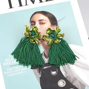 Green bohemian flower tassel earrings with crystals on a TIME magazine cover