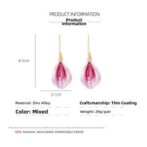 Detail view of pink gradient petal earrings with size marks 8.5cm by 3.1cm