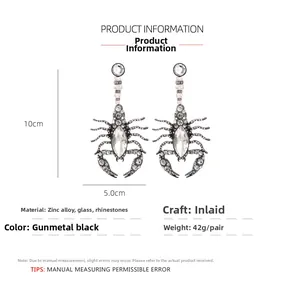 Detail showing oversized gun black scorpion earrings with size 10cm x 5.0cm dimensions