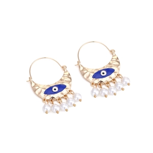 Vintage gold hoop earrings with blue evil eye enamel and white hanging pearls