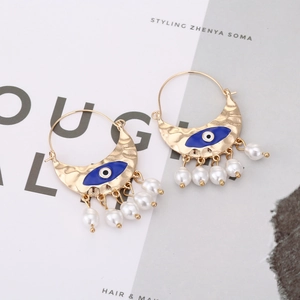 Vintage gold crescent evil eye earrings with enamel finish and hanging white pearls