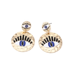 Vintage evil eye enamel earrings with golden hammered texture in a bohemian style