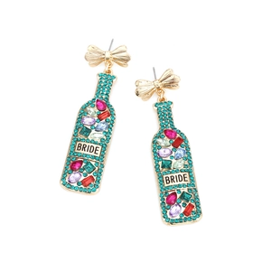 Close-up of champagne bottle earrings with colorful rhinestones and BRIDE text detail