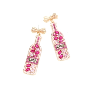 Detail of wine bottle earrings with colorful rhinestones and Bride text for weddings