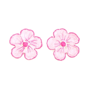 Detailed close-up of pink and white enamel flower stud earrings with golden metal edges