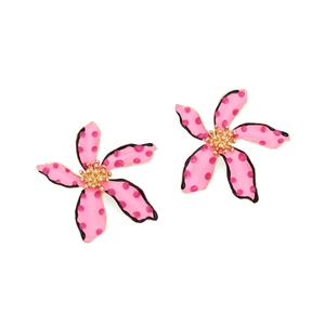 Close-up of pink polka dot flower earrings with golden center and oil drip finish