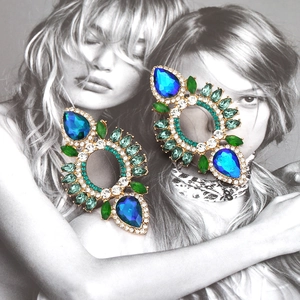 Dramatic bohemian drop earrings with vibrant blue and green crystals on gold alloy base