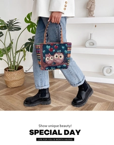 Detailed close-up of ethnic embroidered owl tote bag with colorful woven stripe handles