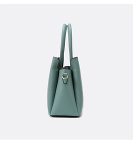 Detail of Morandi blue bag with faux crocodile and lychee leather textures and D-ring