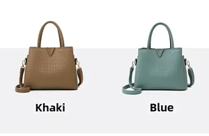 Detail of khaki and blue faux crocodile leather handbags with gold metal V-shape hardware