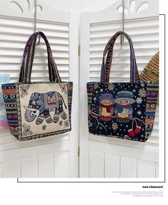 Detailed texture of ethnic canvas tote bags with elephant and owl jacquard embroidery