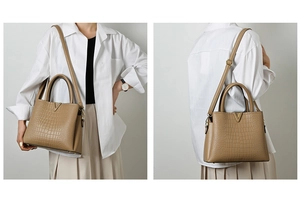 Detail view of khaki faux-crocodile handbag featuring a gold V-shaped metal buckle accent