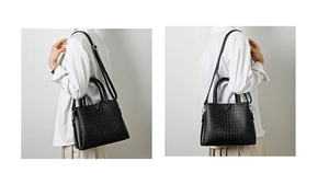 Crocodile pattern bag detail showing golden V-shaped hardware and fine leather texture