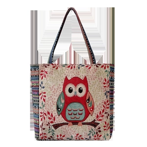 Ethnic canvas tote bag with owl embroidery and colorful striped woven handle straps