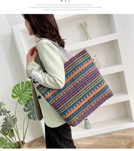 Ethnic striped canvas tote bag shown by a model for a stylish casual shoulder-carry look