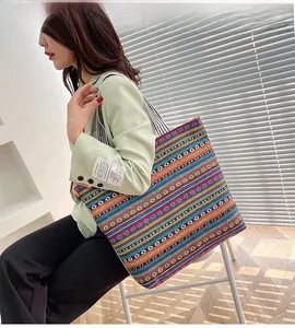 Ethnic style striped canvas tote bag with geometric patterns and striped shoulder strap