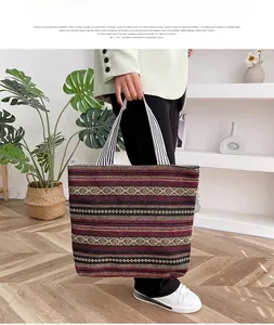 Ethnic canvas tote bag with geometric stripes shown in a minimalist home setting