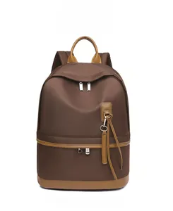 Front view of coffee waterproof backpack with stylish brown leather details and multi-pockets