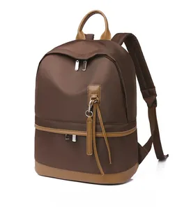 Micro side view of stylish two-tone waterproof backpack with premium leather accents