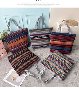 Detailed view of five colorful ethnic bohemian style canvas tote bags with striped patterns