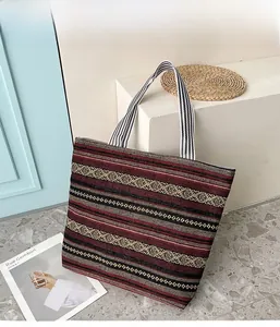 Ethnic style canvas tote bag with red and black stripes and geometric patterns