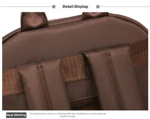 Detail of reinforced S-shaped shoulder straps and neat stitching on dark brown backpack