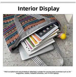 Ethnic style striped tote bag showing large capacity for 14 inch laptop and A4 magazines