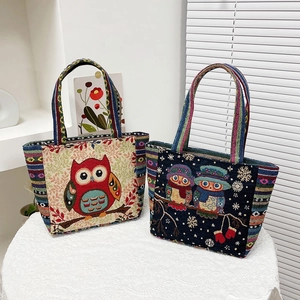 Ethnic embroidered canvas tote bags with owl patterns and colorful striped handles