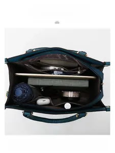 Spacious interior of dark blue crocodile pattern tote bag with multi-compartment storage