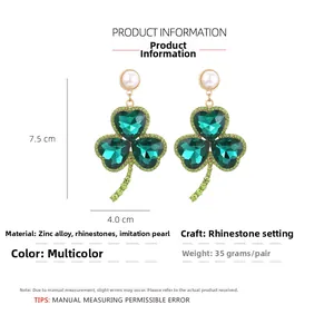 Green heart rhinestone clover earrings detail showing 7.5cm x 4.0cm dimensions and 35g weight