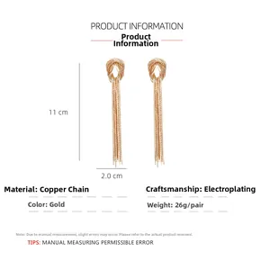 Detailed view of 11cm gold-plated tassel knot earrings with precise measurements