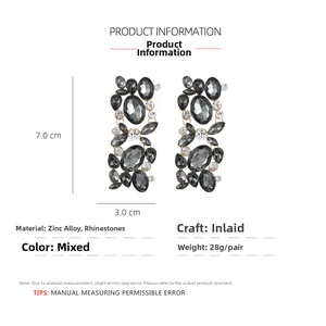 Detailed view of floral long earrings with rhinestones measuring 7.0cm in length